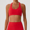 Red sports bra and leggings on a plain background